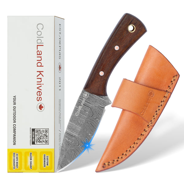 Cold Land Knives knife with wooden handle and leather sheath next to its packaging on a white background
