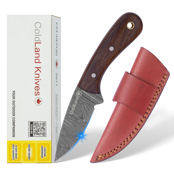 ColdLand Knives knife with wooden handle and leather sheath next to its packaging on a white background