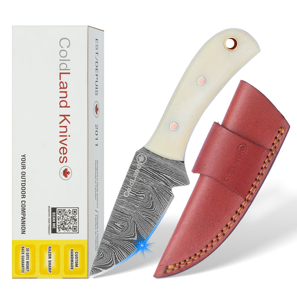 ColdLand White Camel Bone knife and red sheath next to its packaging on a white background